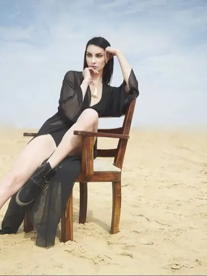 From a calendar shoot in the Bikaner desert. I styled a sheer black kaftan and ankle boots to create a dramatic, nomadic-glam look, using the vast, empty landscape as a powerful backdrop.