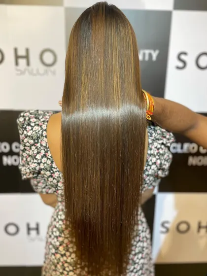 A close-up look at the glossy shine achieved with our hair botox and highlights combination treatment. The hair looks and feels incredibly healthy.