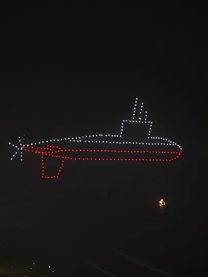 An aerial submarine formation created for our Indian Navy Day show. This display honored the silent guardians of our deep seas, showcasing their strength and strategic importance through light.