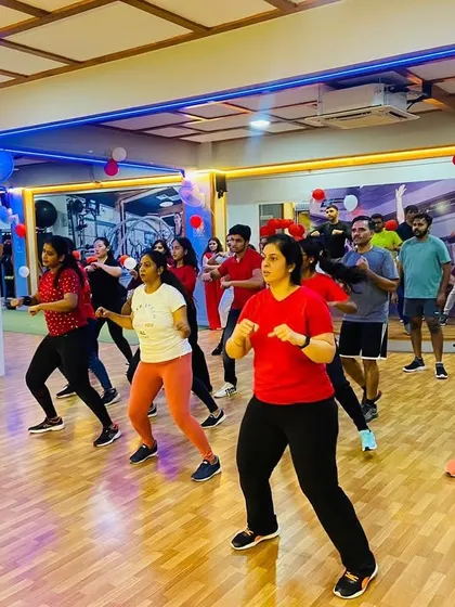 Our members enjoying a special Christmas-themed dance fitness class, dressed in red and white to celebrate the season.