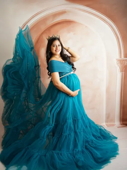 Another shot from the teal gown session, this time with a fabric toss to create a sense of drama and movement, like flowing wings.