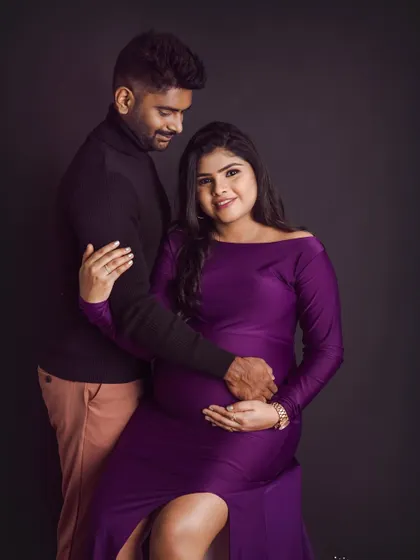 The deep purple gown looks so regal in this couple's portrait. We posed them to create a sense of intimacy and shared anticipation.