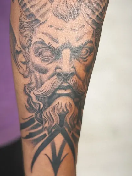 The full view of the forearm tattoo, showing how the design is composed to fit the arm perfectly.