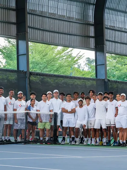 All whites and all smiles! Our players and coaches come together for a group photo, showcasing the strong sense of family and community that is at the heart of our academy.