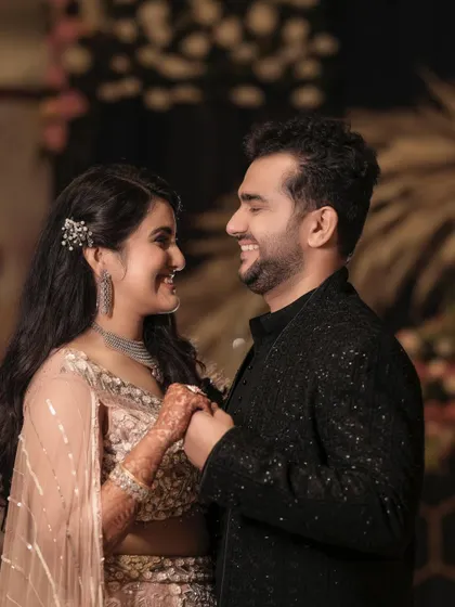A happy, candid-style portrait of the couple during their engagement celebration. Their smiles and the way they look at each other tell a story of genuine joy and excitement.
