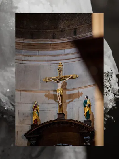 A detail shot of the crucifix inside the church, setting a reverent and spiritual tone for the Christian wedding gallery.