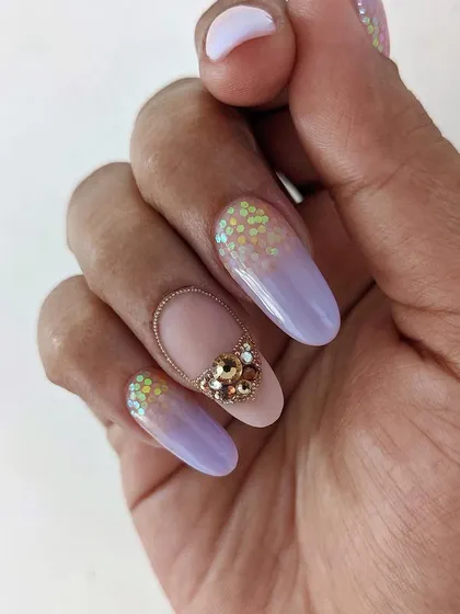Another look at the lavender ombre set, focusing on the interplay between the soft color gradient, the iridescent glitter, and the intricate crystal work.