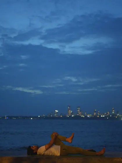 A series of images from Marine Drive at twilight, featuring people finding moments of solitude and connection against the city skyline. The photos are paired with poetic quotes about life, love, and hope.