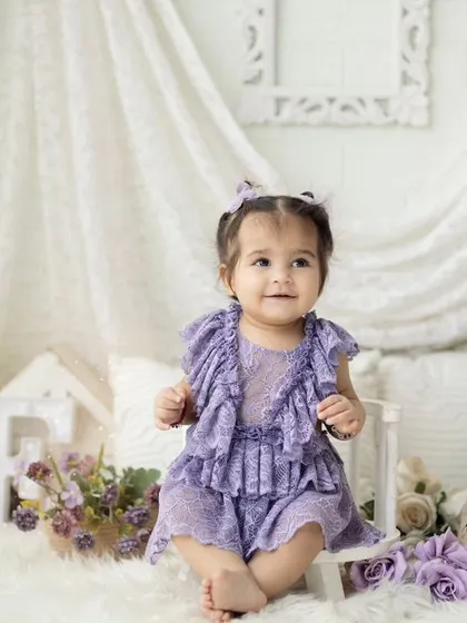 A lovely portrait from a purple-themed first birthday session. We have a wide variety of outfits and props to match any color scheme you can imagine.