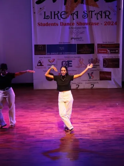 A trio of dancers striking a final pose, concluding their powerful performance.