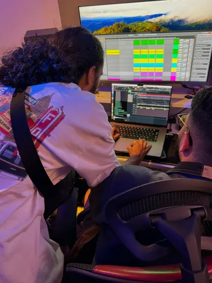 Collaboration is key. Here I am in the studio with another artist, working on a track together. Bouncing ideas off other creative people is one of the best parts of the production process.