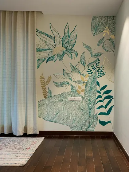 Here, I used a combination of emerald green line work and solid gold painted leaves to create a modern botanical mural. The contrast between the detailed lines and the flat, metallic gold adds a contemporary touch.