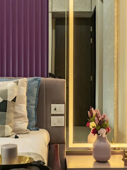 A close-up of the dressing area in this master bedroom. The full-length mirror is framed with integrated LED lighting, providing perfect illumination while adding a touch of glamour.