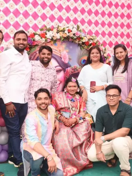 A large group of friends and family gather around the mom-to-be.