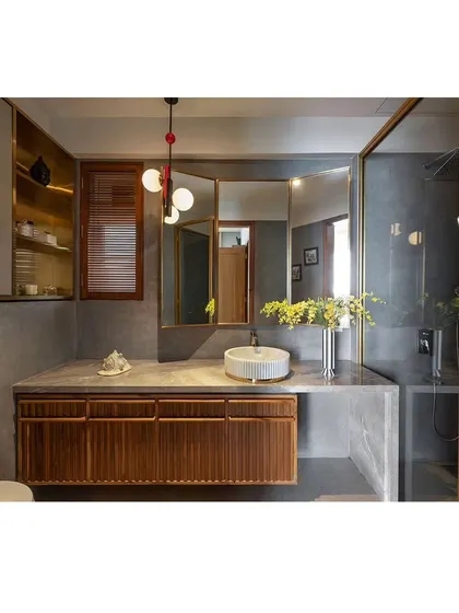 A custom-designed bathroom vanity in fluted wood with a terrazzo countertop. Every detail, from the cabinet pulls to the proportions, is carefully considered to create a cohesive and highly functional piece.