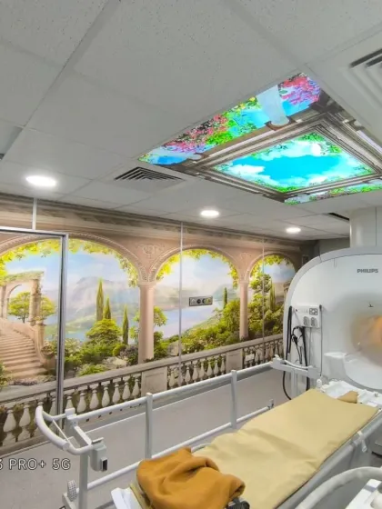 A full view of the MRI room, showing how the wallpaper transforms a clinical space.