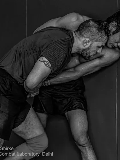 Wall work. Seth Rosario using his wrestling to control Rahul Thapa against the wall. This is a game of inches.