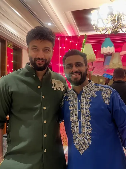 Coordinated looks for wedding guests, featuring a custom olive green kurta and a royal blue kurta with heavy traditional embroidery.