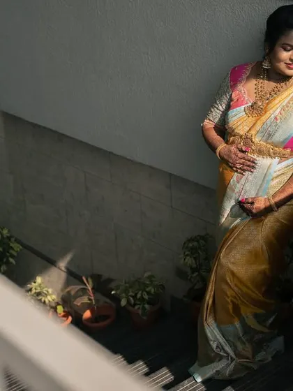 Using interesting shadows and light, this photo captures the mother-to-be in a quiet moment of contemplation on a staircase.