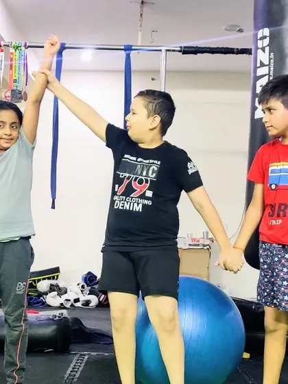 Celebrating sportsmanship after a friendly match. We teach our kids to respect their training partners and support each other's growth, creating a positive and encouraging environment.