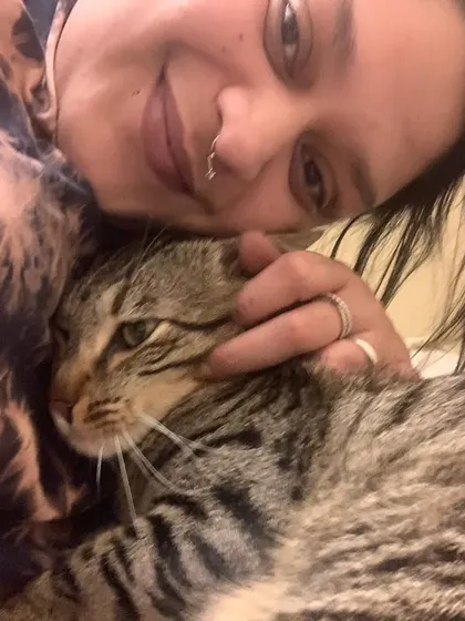 A quiet, cuddly moment with a sweet tabby. It's these moments of pure trust and affection that make all the hard work worth it.