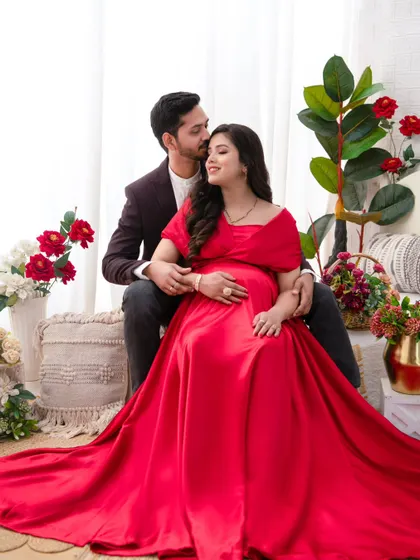 A tender moment captured as the husband whispers to his wife. These candid interactions are what make a maternity session so personal and memorable.