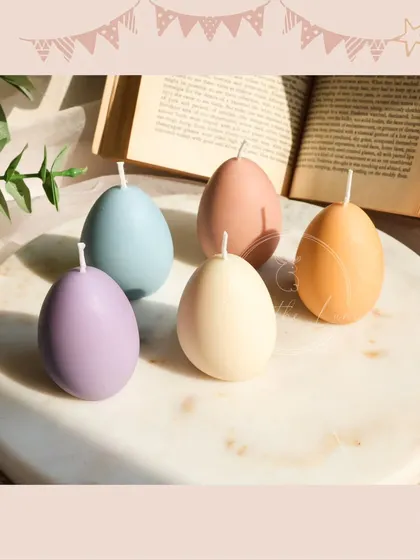 The simple pastel egg candles, arranged on a marble tray. Their smooth finish and beautiful colors are perfect for a modern spring aesthetic.