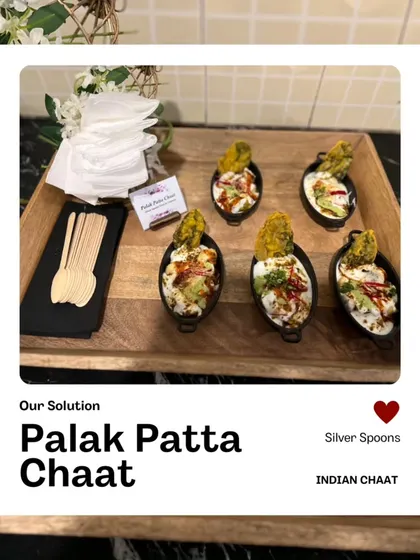 Our Palak Patta Chaat is a signature item, served in unique boat-shaped bowls with a wooden spoon. Each bite is a perfect mix of crispy, creamy, and tangy flavors.