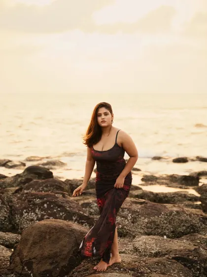Another shot from the golden hour beach session, this time with a more direct and engaging pose. The warm light and gentle breeze create a relaxed and beautiful lifestyle portrait.