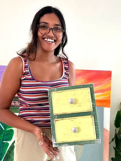 A smiling participant with her cheerful green and yellow distressed drawers.