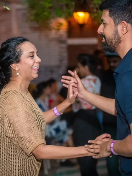 A gentle and connected dance between two partners. The atmosphere is always warm and friendly.