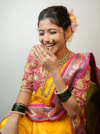 A candid laugh that lights up the photo, showcasing a natural and happy bride.