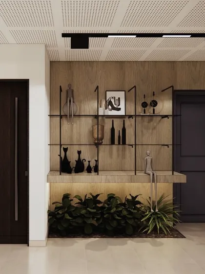 This design concept for an office feature wall uses a simple shelf with curated decor and integrated lighting. It's an elegant way to add personality and a focal point to a transitional space.