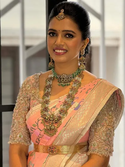 A beautiful portrait of the client. The intricate details of her jewelry and the embroidery on her blouse are simply breathtaking.