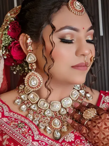 A close-up of this gorgeous bride. The look features sparkling glittery eyes, flawless skin, and beautiful jewelry, all coming together for a perfect bridal portrait.