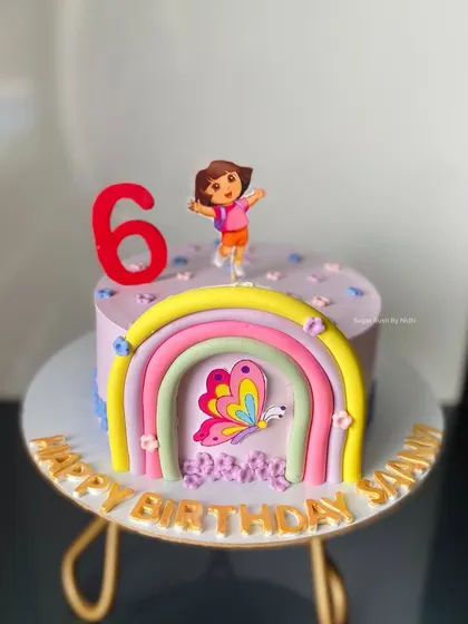 Swiper, no swiping! A cute Dora the Explorer cake for a 6th birthday. This cake features a colorful rainbow and a butterfly, perfect for a little adventurer.