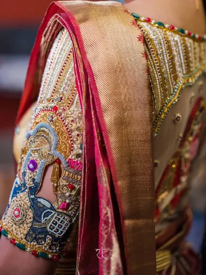 A closer look at the soul of my craft. This bridal blouse sleeve features elaborate zardosi and threadwork, with traditional motifs like the elephant symbolizing strength and prosperity, all meticulously hand-embroidered.