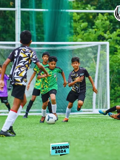 A player breaks away with the ball, showcasing speed and agility.