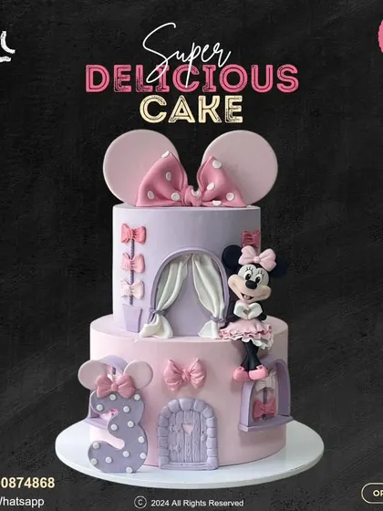 A gorgeous two-tier Minnie Mouse castle cake for a 3rd birthday. This detailed creation in pink and lavender features a fondant Minnie, castle doors, and windows for a magical celebration.