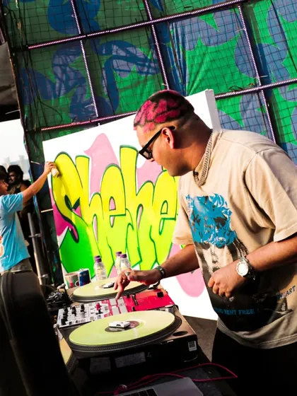 Me painting my 'Sheher' piece live on stage at NH7 Weekender, with DJ The Spindoctor right next to me. It was a true fusion of hip-hop elements.