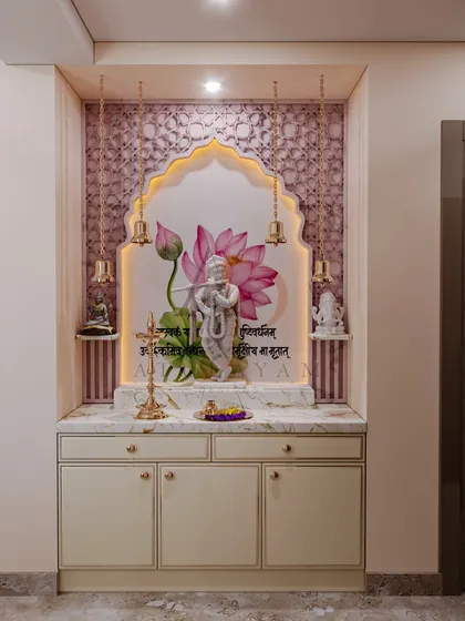 A serene mandir design featuring a beautiful Krishna idol against a lotus backdrop, framed by an arch with intricate patterns and hanging bells.