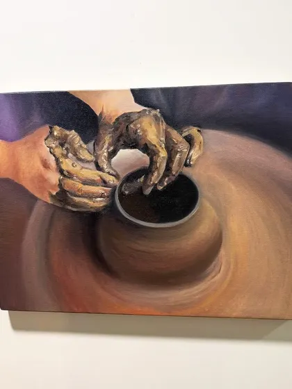 An oil painting capturing the motion of a potter's wheel. I wanted to convey the feeling of creation and the hands-on process of making art.