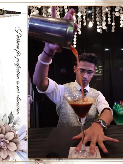 An expertly crafted Espresso Martini being poured, showing the rich crema on top which is a sign of a well-made cocktail.