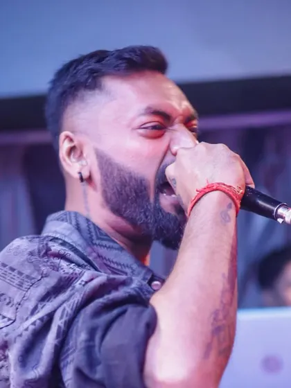 A close-up, high-intensity shot of me performing at a club. This is the raw energy I bring when the beat drops.