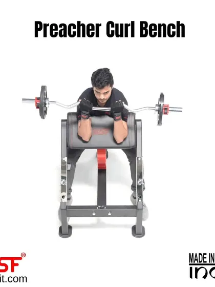 A front view of a user at the top of the curl on the Preacher Curl Bench.