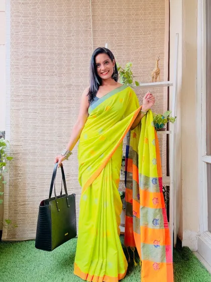 This lime green khadi cotton saree with a colorful pallu is so vibrant. It's a great way to add a pop of color to your ethnic wardrobe.