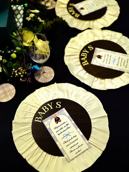 Custom-made rosettes served as unique place cards and party favors. This detail, inspired by equestrian awards, was a perfect nod to the 'Polo Club' theme and a delightful keepsake for guests.