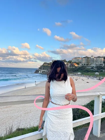 A windy day at Bondi Beach, with a simple pink squiggle to represent the sea breeze.