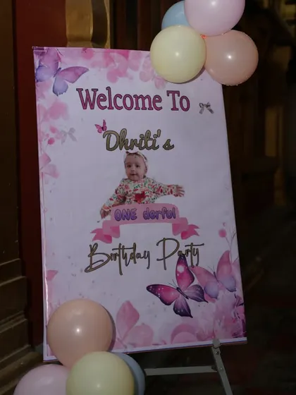 A personalized welcome sign for a fairy tale and butterfly-themed first birthday.