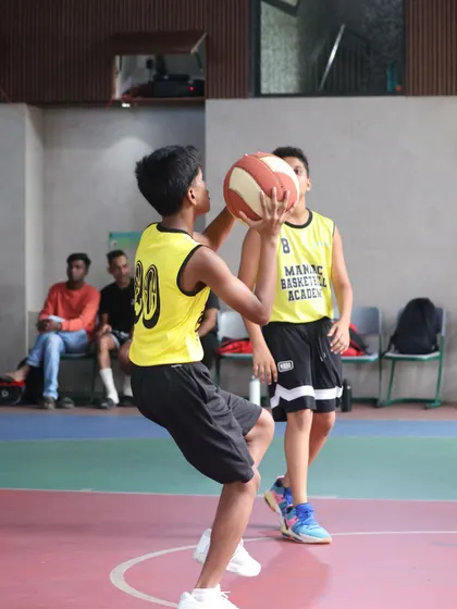 A player in shooting motion, demonstrating proper form. The pride and growth from our training sessions last long after the game is over.